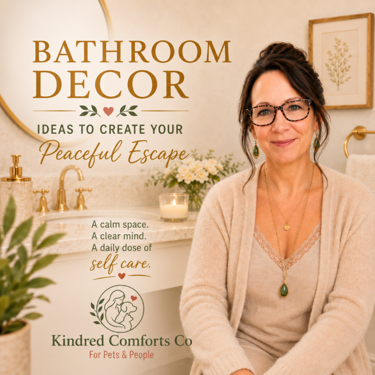 Woman wearing glasses and green jewelry sits in a warm, spa-inspired bathroom with soft beige décor, gold fixtures, fresh flowers, and a lit candle beside the text "Bathroom Décor – Ideas to Create Your Peaceful Escape" from Kindred Comforts Co.